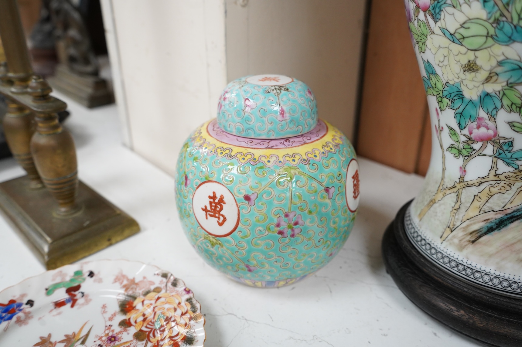 A collection of Chinese ceramics to include enamelled ginger jar and cover, floral plate and a vase, largest 40cm high
